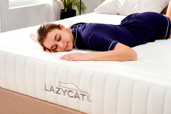 lady peacefully sleeps on lazycat matress cream