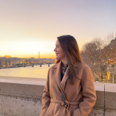 Woman wearing camel trench coat