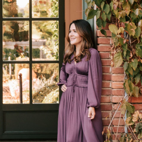 Joyasol founder wearing purple dress
