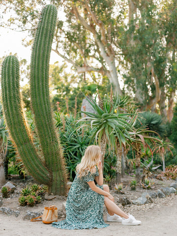 woman in nature wearing Joyasol sustainable sneakers