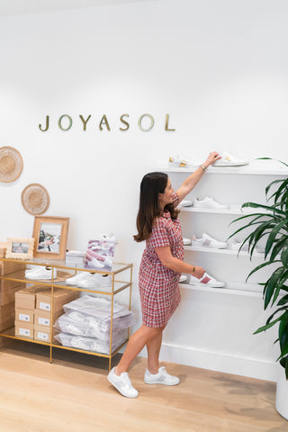 Joyasol founder Christina Bullock cleaning shoe office