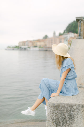 woman in Lake Como wearing Joyasol sustainable sneakers