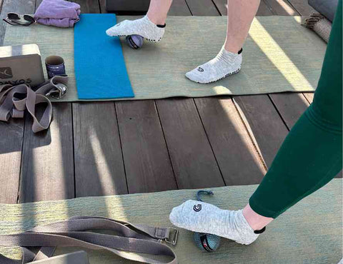 Pilates mat warm up - using grips on socks to stretch foot