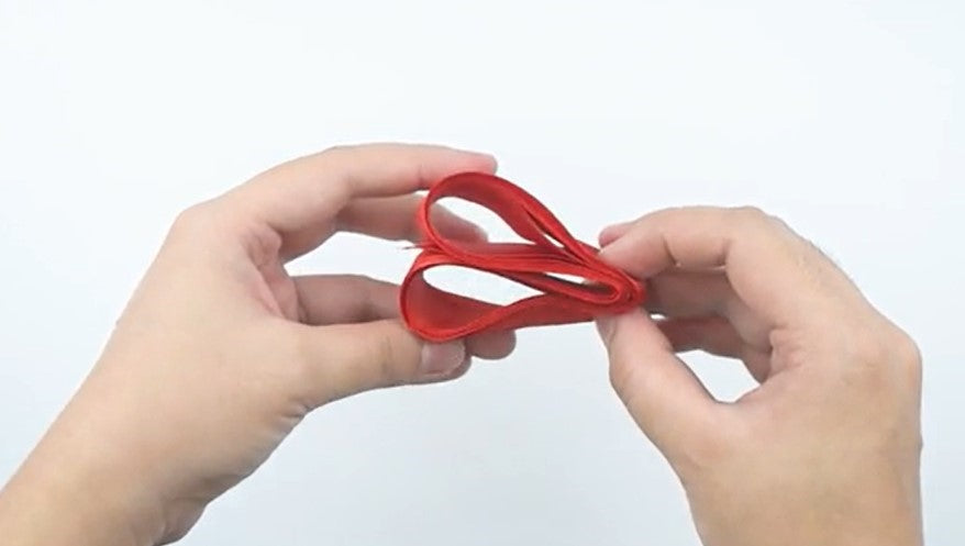 remove them from your hand and fold the ribbon loops in half