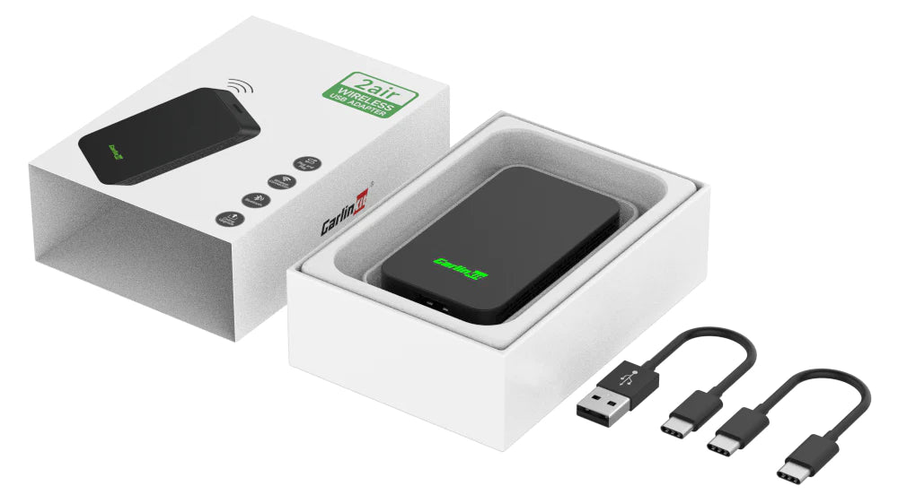 The contents of the Carlinkit 2air package, including the device, a user manual, and necessary cables