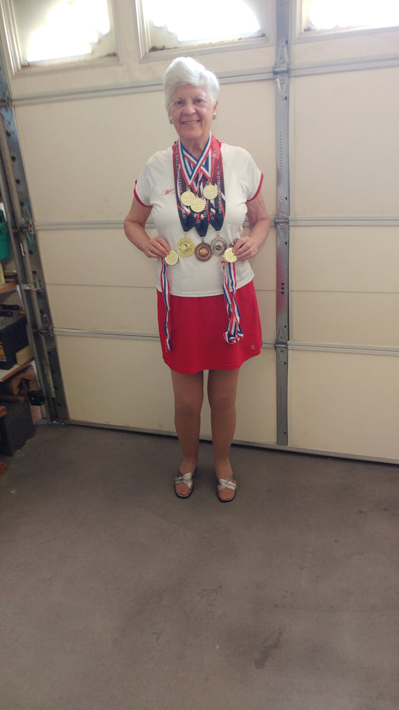 Joyce Jones poses with the 8 medals she won in the Huntsman World Games.