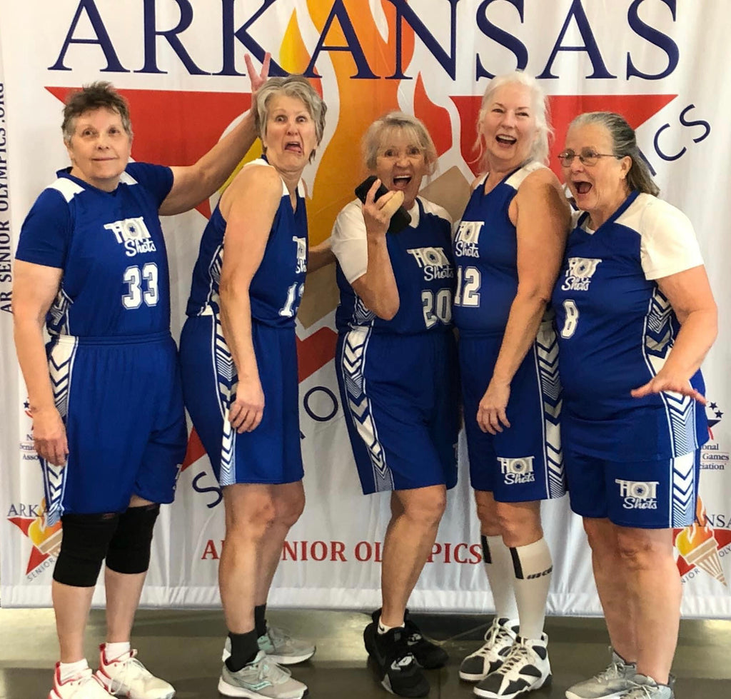 Angela poses with her team the Oklahoma Hot Shots.