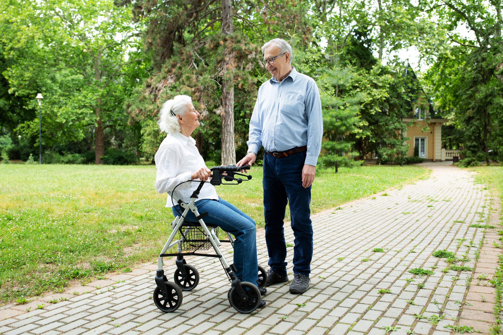 A person sitting in a rollator.