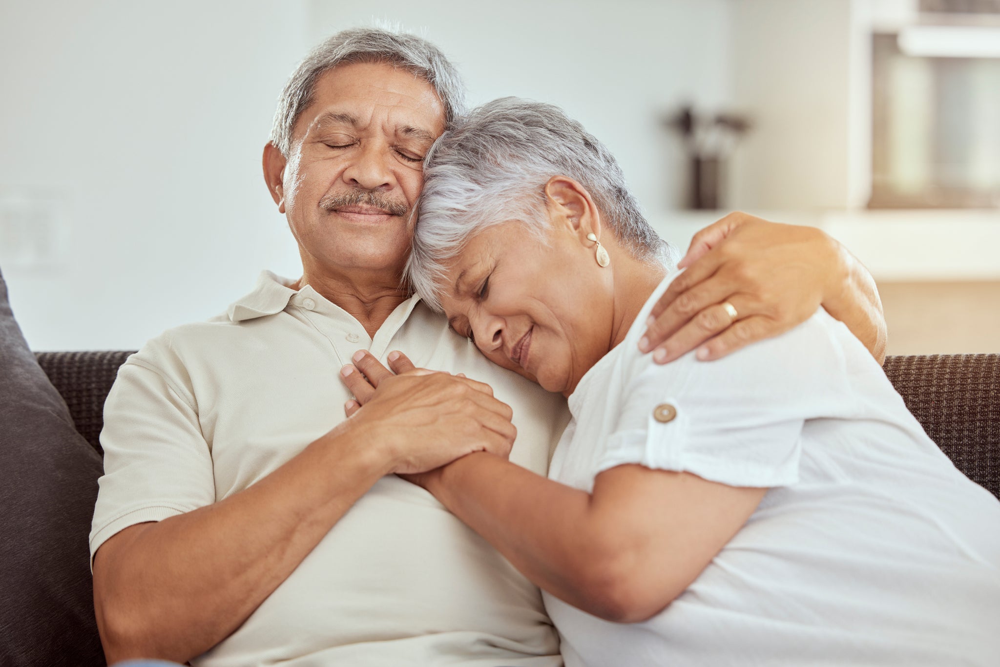 A couple embraces lovingly.