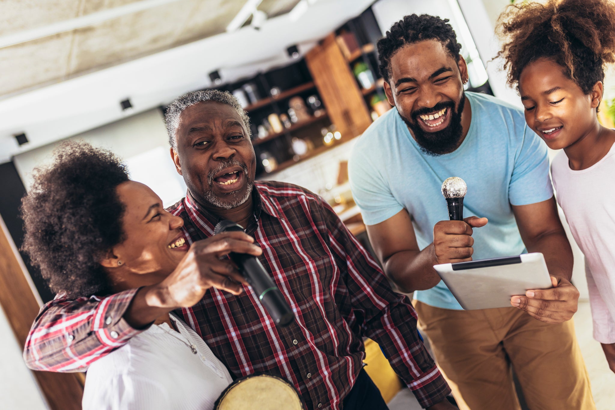 A family singing karaoke.