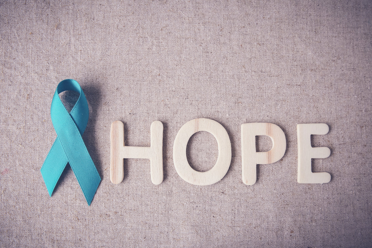 A blue awareness ribbon and the word hope.