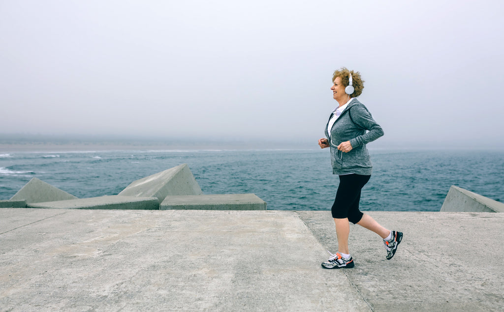 Woman running on boardwalk