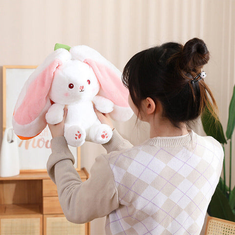 Woman holding a cute Bunny Stuffed Toy.