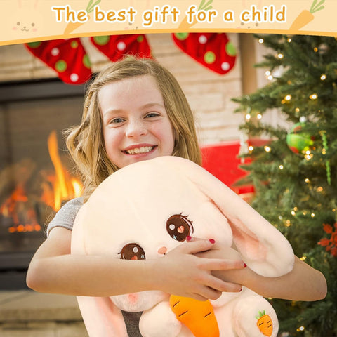 Little girl holding a fluffy plushie bunny.