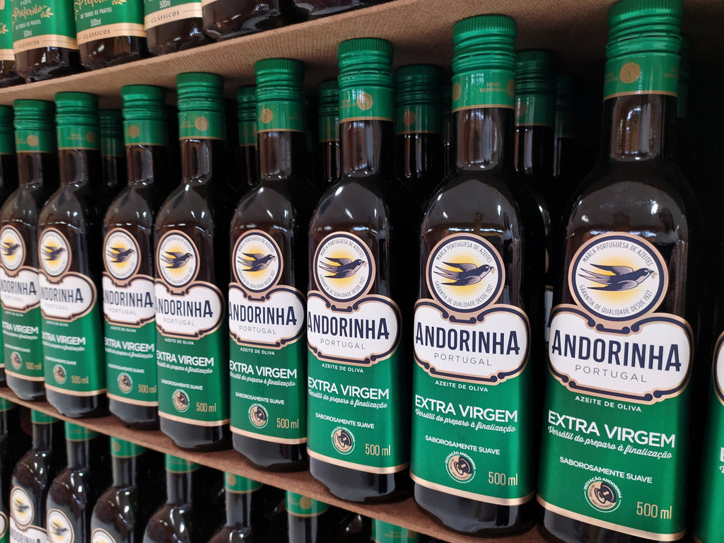 Portuguese olive oil in dark glass bottles on a store shelf