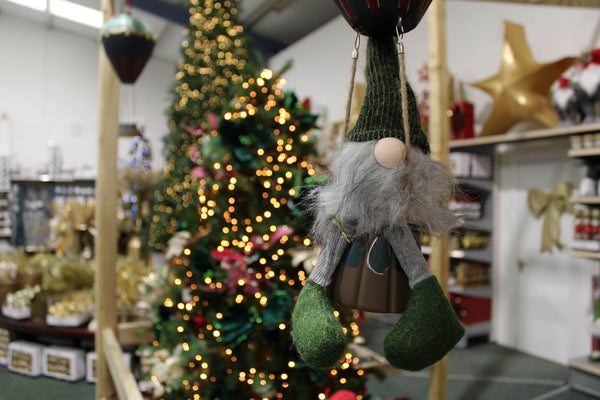 Gonk in Hot Air Balloon Decoration with Christmas Decorations and Tree in the background