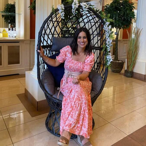 Lucy Kennedy Sitting in the McD's Swivel Egg Chair with Garland