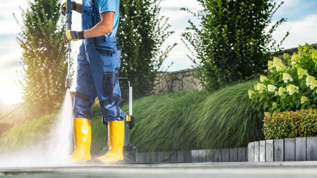 Man Power Hosing Patio of Garden