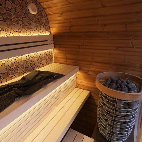 Electric heater in wood sauna