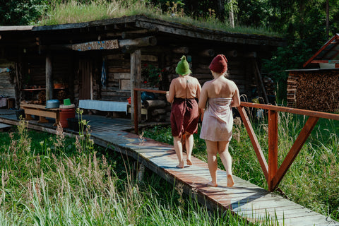 Women walking to outdoor sauna