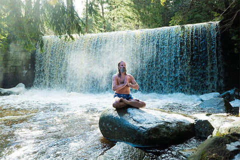 Wim Hof meditation at waterfall