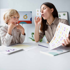 Women teaching child how to speak.