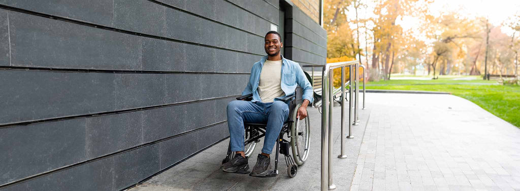 Railing for disabled man in wheelchair.