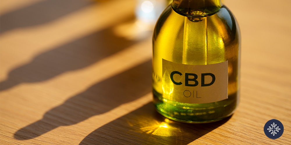 A close ip to a small bottle of CBD Oil