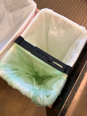 trash bag and compostable bag divided using Eco-Sorter for kitchen compost