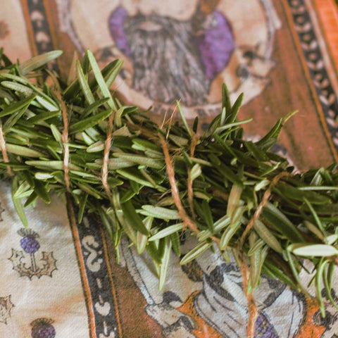 rosemary bundled into a smudge stick wrapped in jute twine