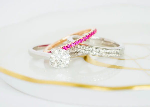 Pink and diamond bands and diamond engagement ring