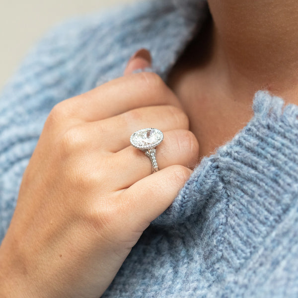 Oval diamond ring with blue sweater