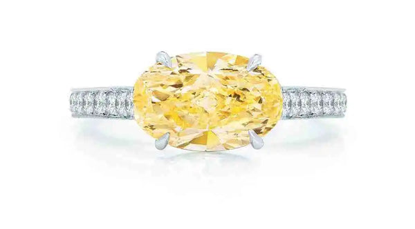 Oval cut yellow diamond ring