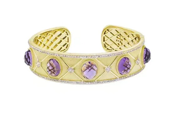 Gold bangle with purple stones