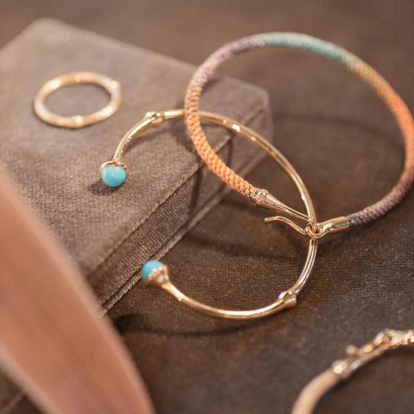 Gold and teal bangle