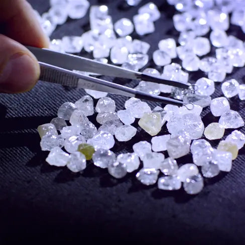 Loose diamond stones with tweezers