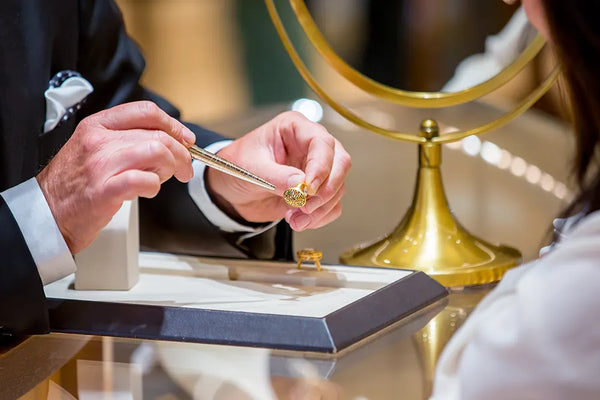 Jeweler showing yellow gold ring