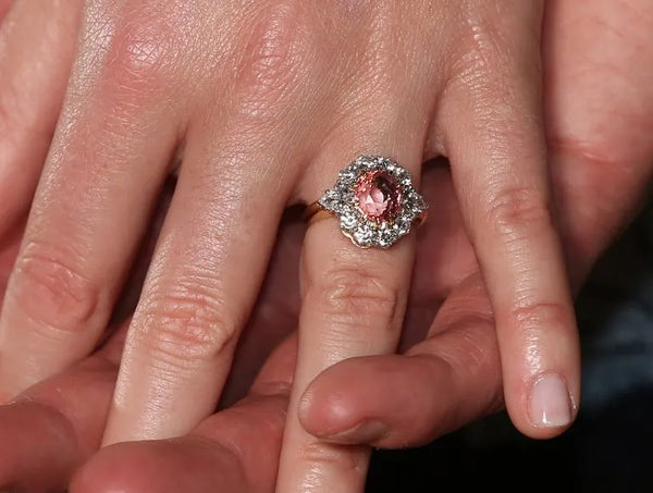 Red gemstone ring with diamonds