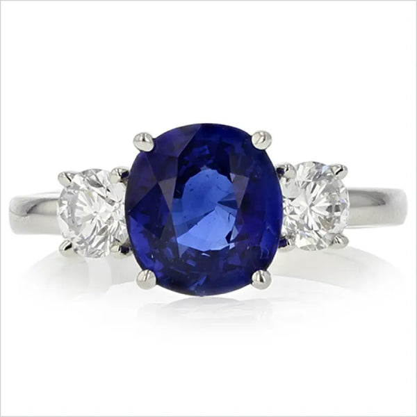 Blue gemstone and diamond ring