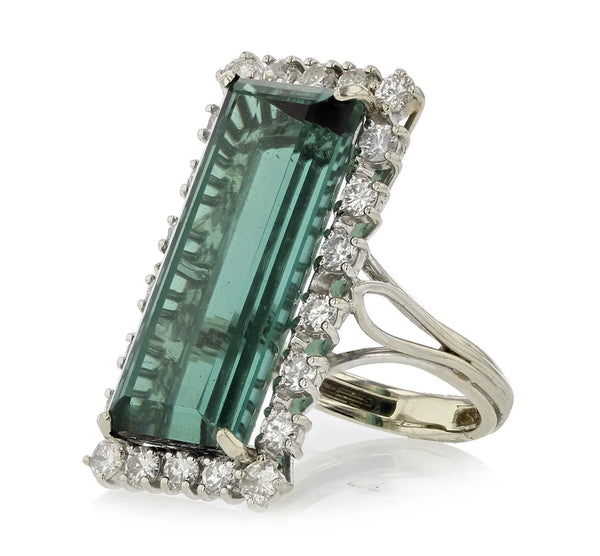 Green gemstone and diamond ring