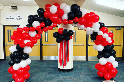 red and black balloon arch