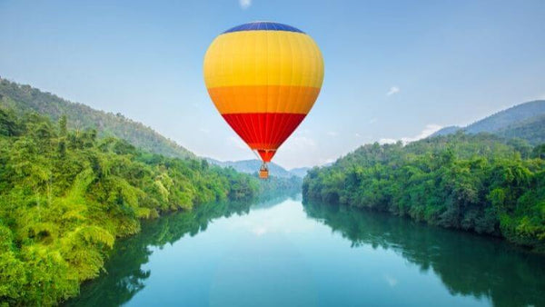 Hot air balloon over river