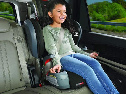 Little girl sitting in forward facing car seat