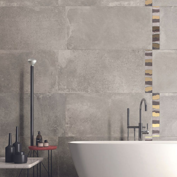 grey bathroom tiles and bathtub