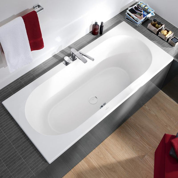 built-in acrylic bath with grey side panel