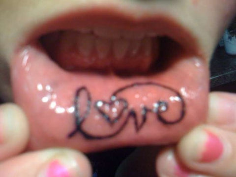 love inner lip tattoo
