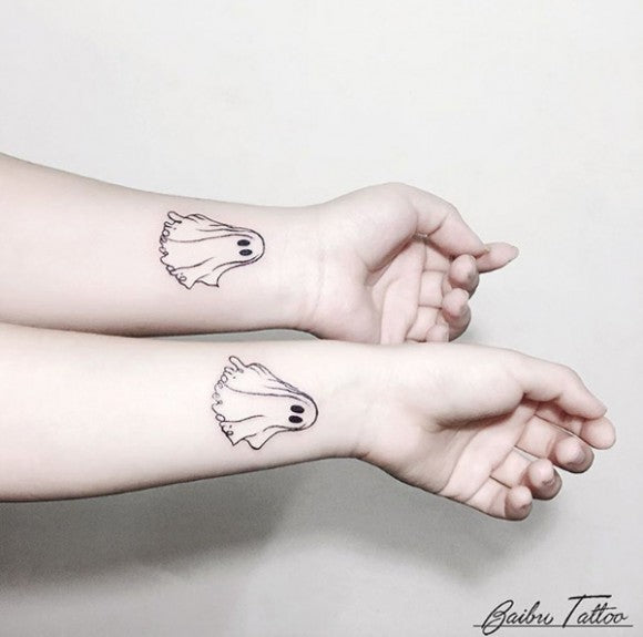 Matching ghost tattoos by Baibu