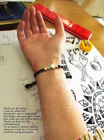 forearm white ink tattoo
