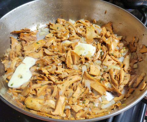 Chanterelle mushrooms cooking in butter