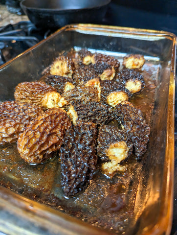 Crab stuffed morel mushrooms being cooked